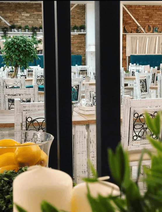 Fresh herbs, lemon and candle table decor